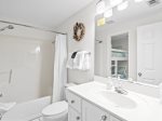 Full bathroom with tub/shower combo. Access from hall or master bedroom